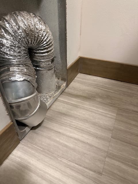 Dryer vent after cleaning with buildup removed from the new set