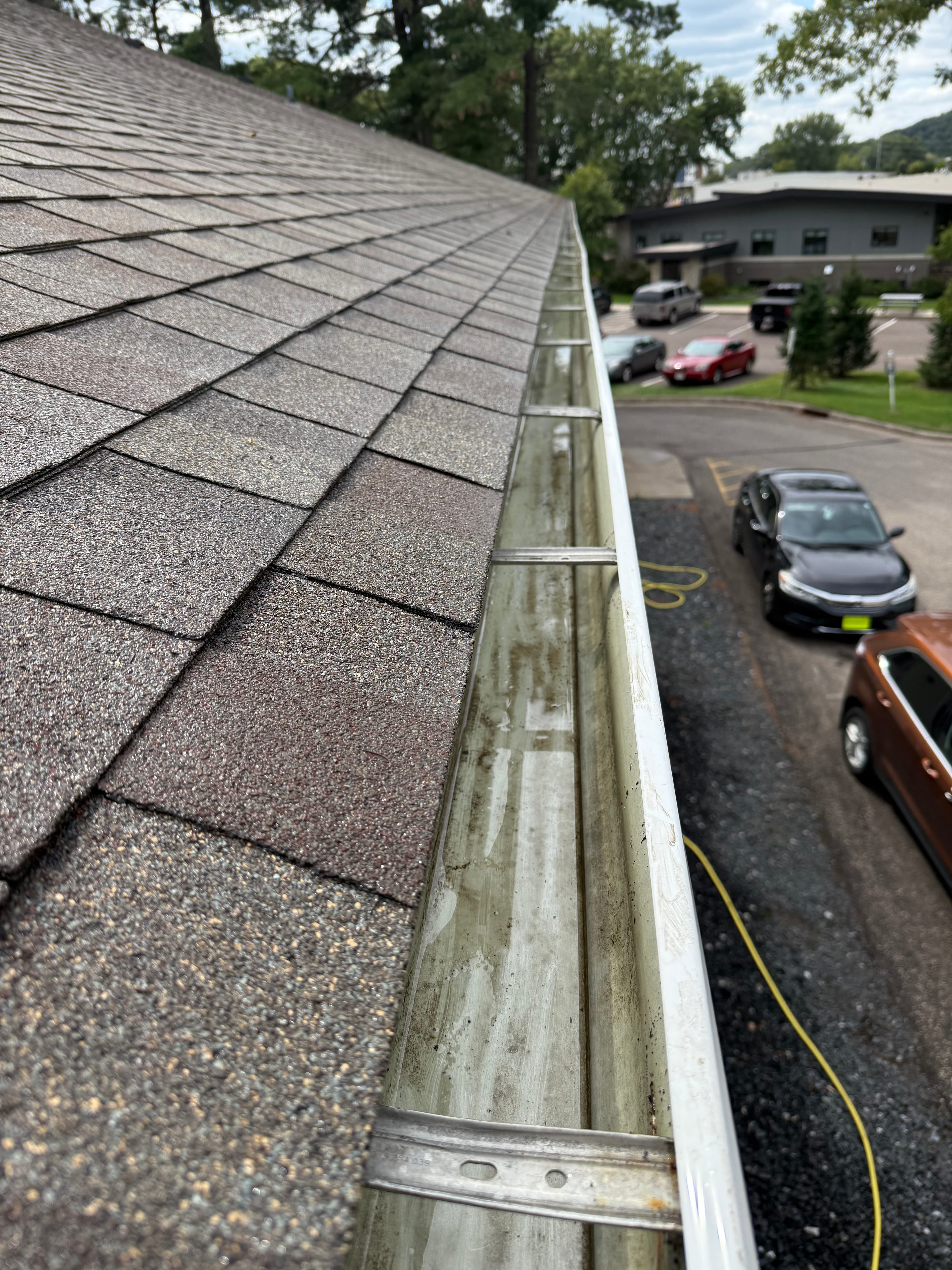 Gutter after cleaning with clear drainage restored