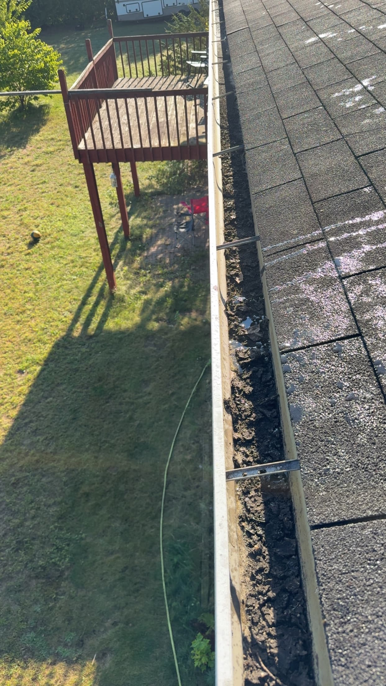 Gutter before cleaning with debris