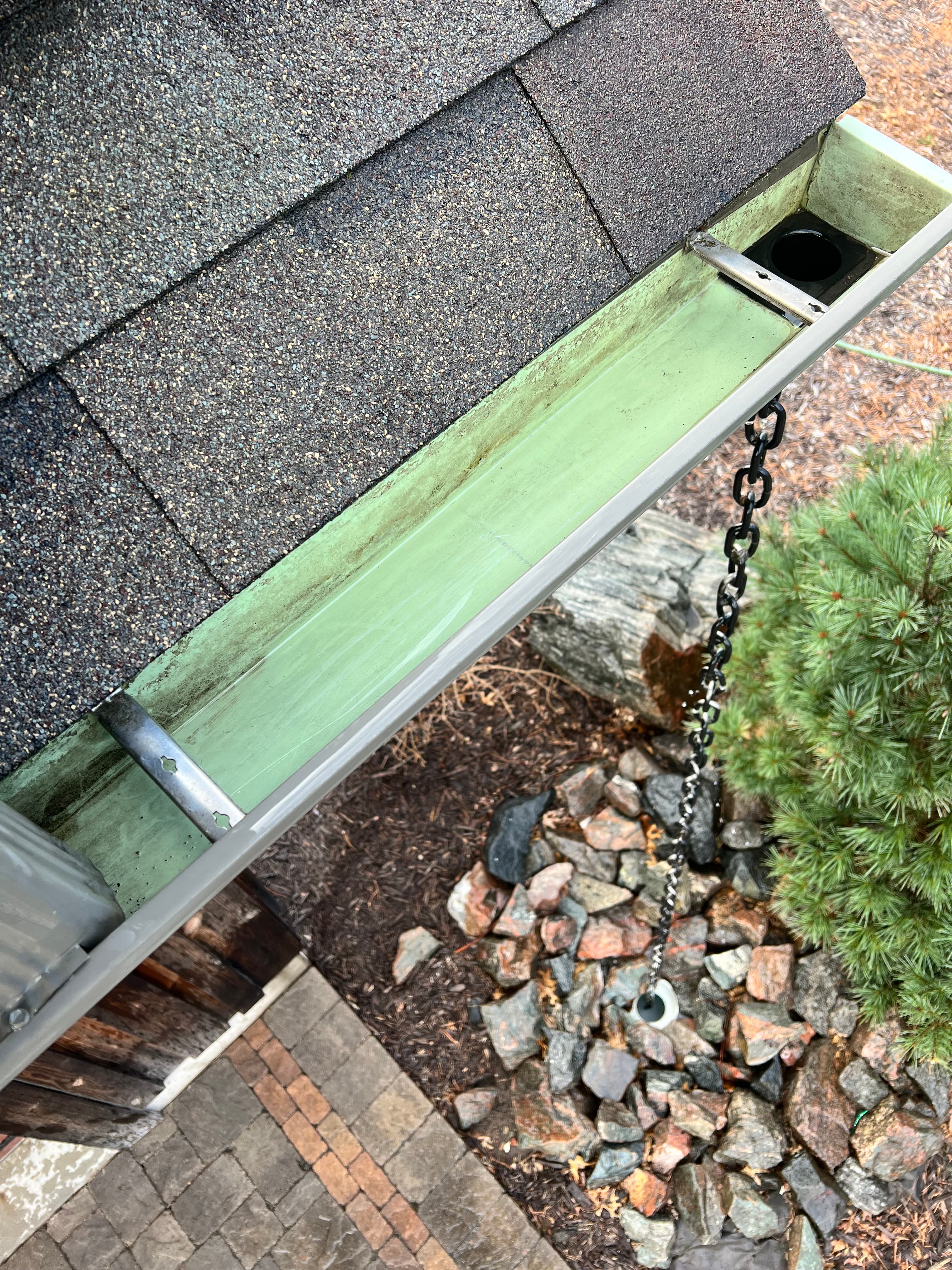 Gutter after cleaning with clear flow restored