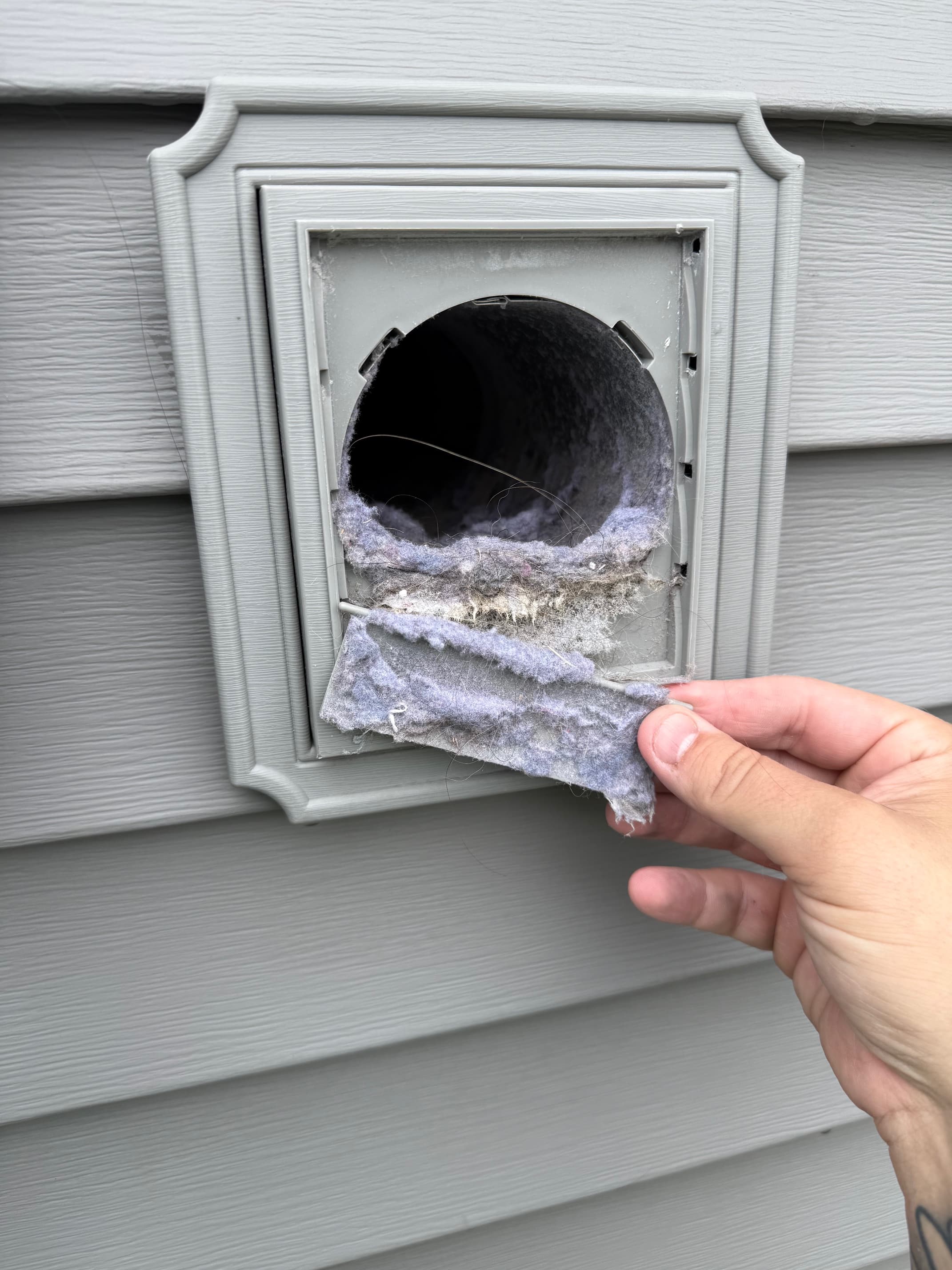 Dryer vent before cleaning with lint buildup
