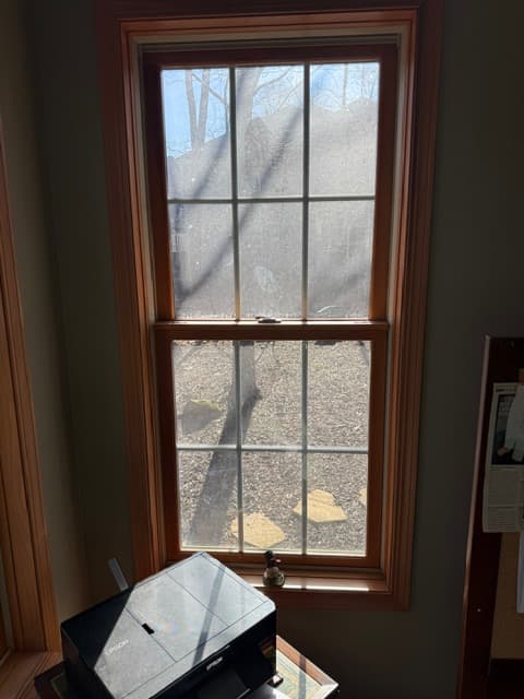 Window before professional cleaning with buildup from the new set