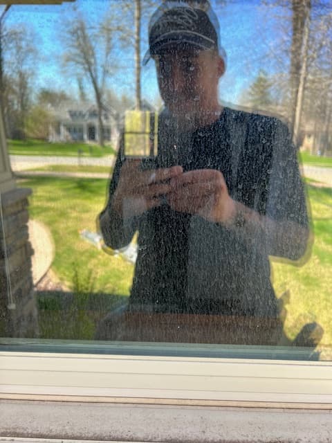 Window before professional cleaning with visible buildup