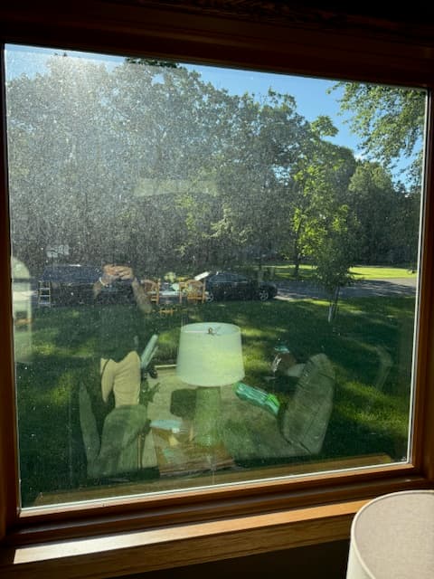 Window before professional cleaning with streaks and dirt
